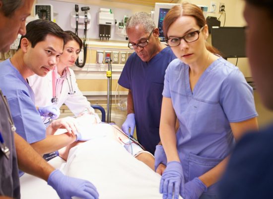 medical-team-working-on-patient-in-emergency-room.jpg
