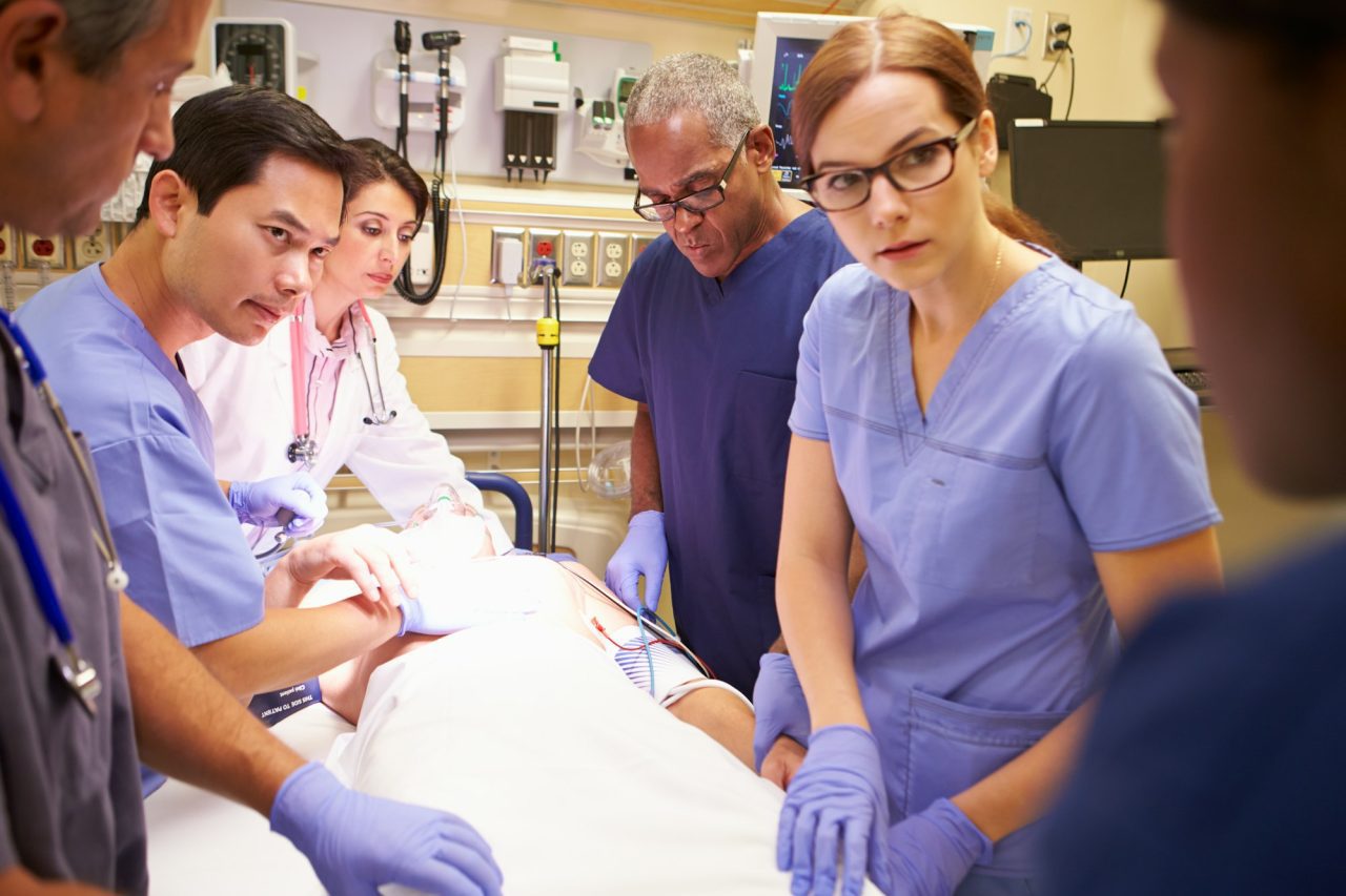 medical-team-working-on-patient-in-emergency-room.jpg